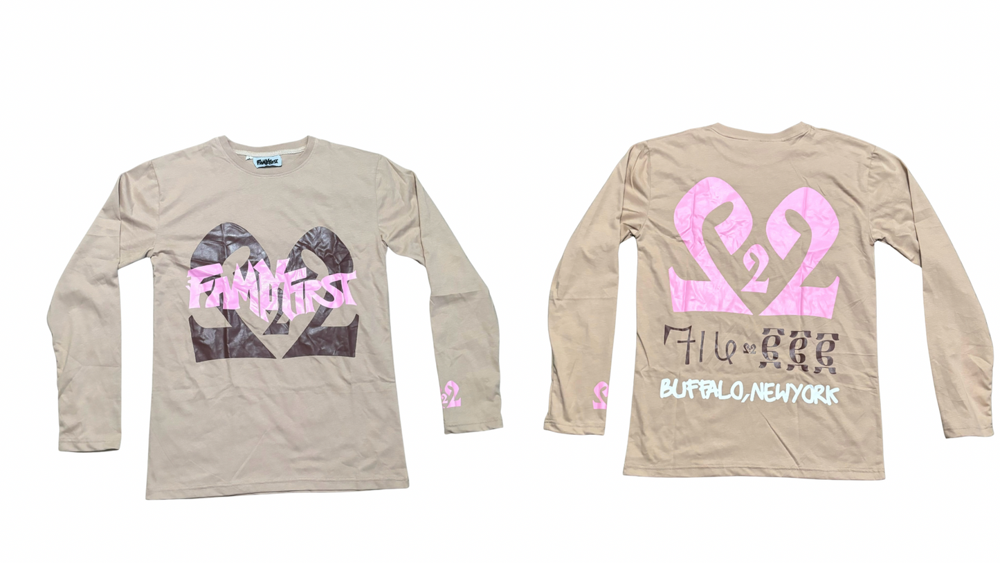 Two beige long-sleeve shirts with pink and brown designs on a white background